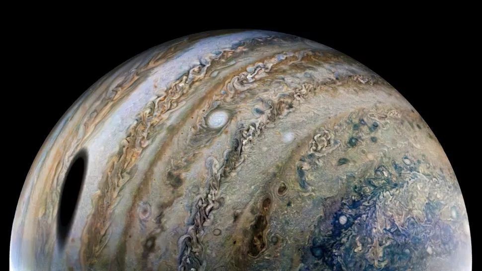 Shadow of Jupiter’s largest moon looms in magnificent new Juno photo